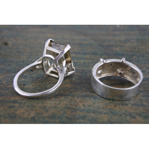 595 - A smokie quartz sterling silver dress ring and another.