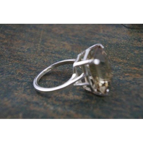 595 - A smokie quartz sterling silver dress ring and another.