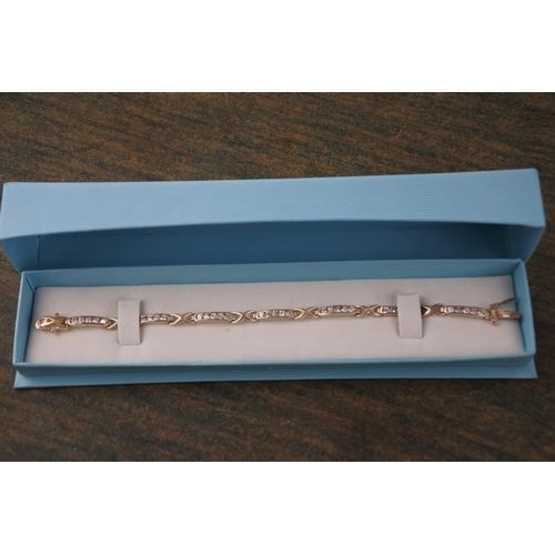 596 - A boxed Eclipse sterling silver bracelet with cz stones