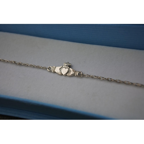 597 - A boxed Eclipse sterling silver Claddagh bracelet