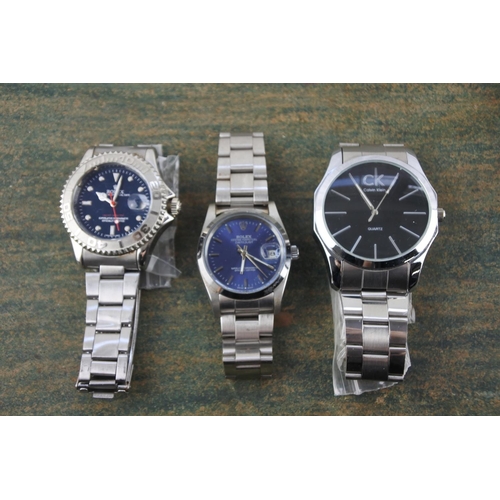 599 - 3 Gents fashion wristwatches.