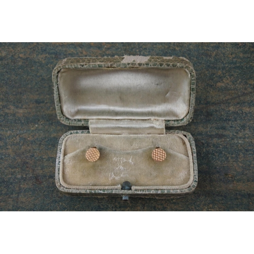 620 - A pair of vintage cased rolled gold collar buttons.