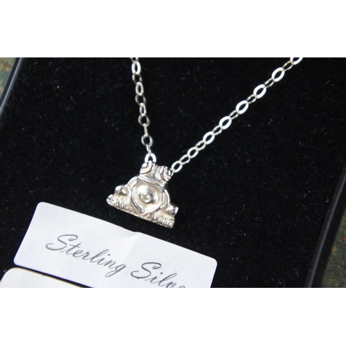 633 - A sterling silver necklace with frog pendant.