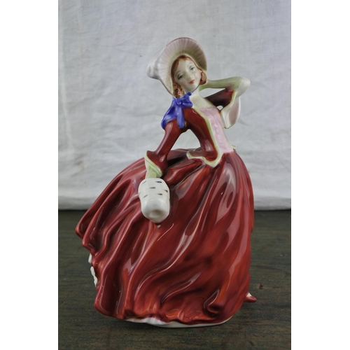 665 - A Royal Doulton figurine 'Autumn Breezes' HN1934.