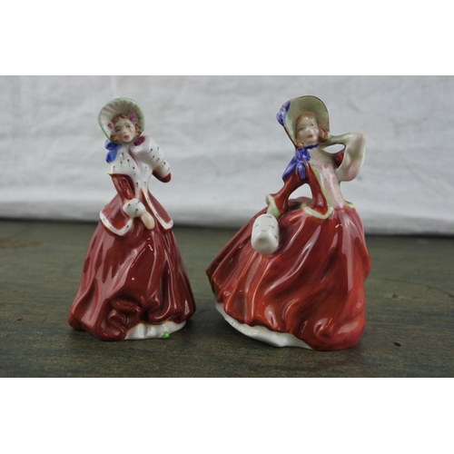 668 - Two small Royal Doulton figurines 'Autumn Breezes' HN2167 and 'Christmas Morn' HN3212.