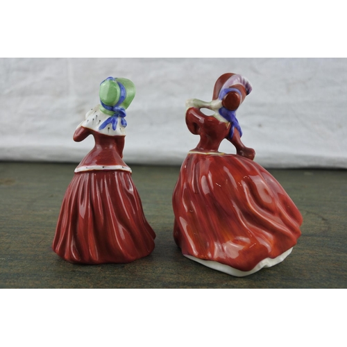 668 - Two small Royal Doulton figurines 'Autumn Breezes' HN2167 and 'Christmas Morn' HN3212.