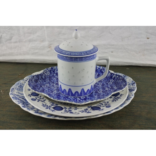 671 - A lot of blue and white ceramic plates and a lidded candle.