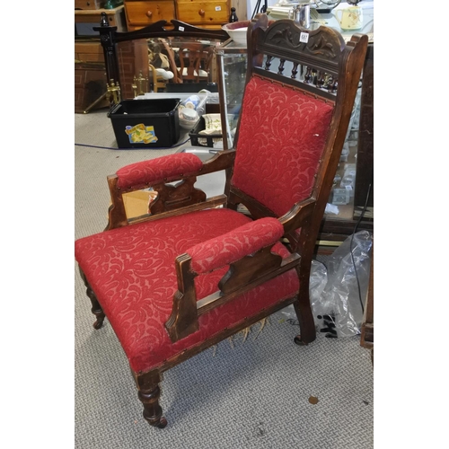 687 - An antique upholstered armchair.