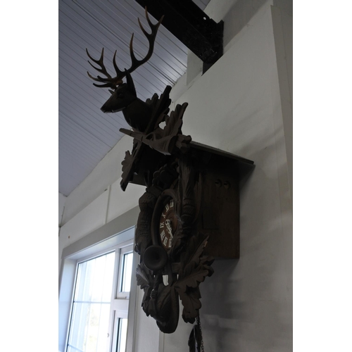 690 - A stunning very large cuckoo clock in need of restoration.