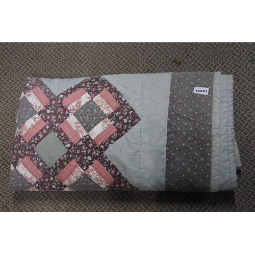 691 - A patchwork quilt bed throw.