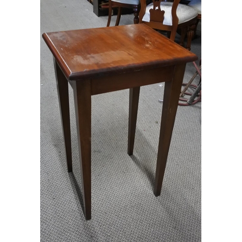 692 - A tall mahogany occasional table.