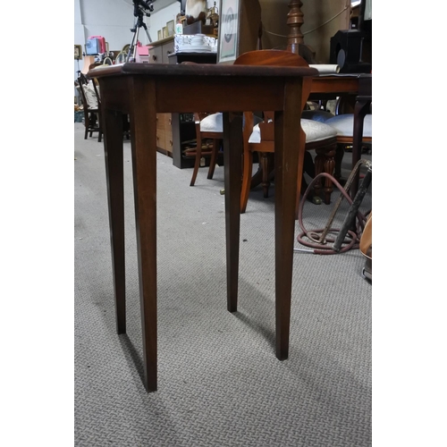 692 - A tall mahogany occasional table.