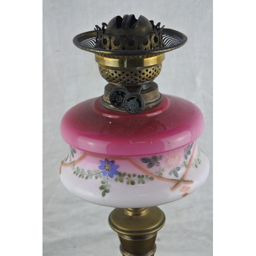 698 - A stunning antique oil lamp with hand painted font.