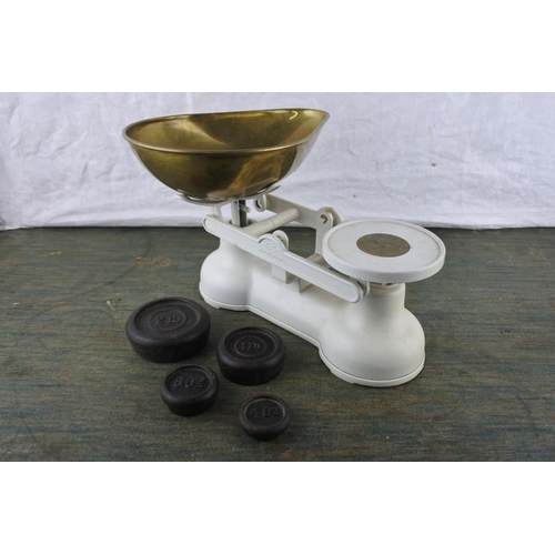 701 - A set of Salter weighing scales and weights.