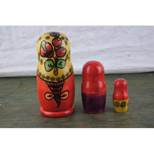 702 - A set of Russian stacking dolls.