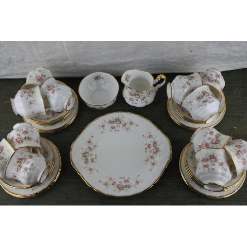 708 - A stunning 12 piece setting Paragon 'Victoriana Rose' tea set including milk jug, sugar bowl and cak... 