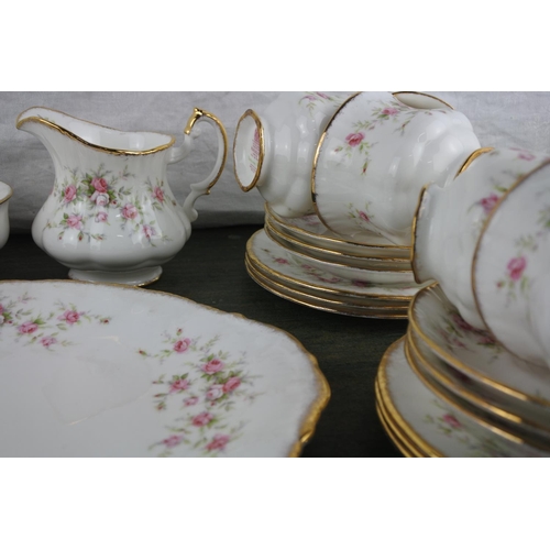 708 - A stunning 12 piece setting Paragon 'Victoriana Rose' tea set including milk jug, sugar bowl and cak... 