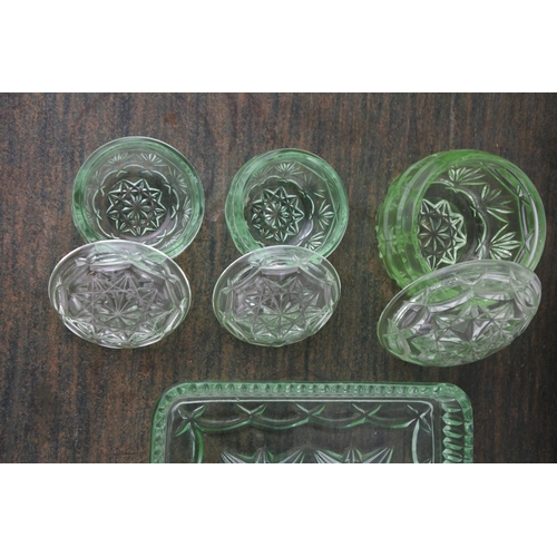 711 - A vintage green glass dressing table set.