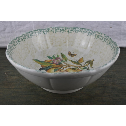 715 - A large bowl with fruit pattern.