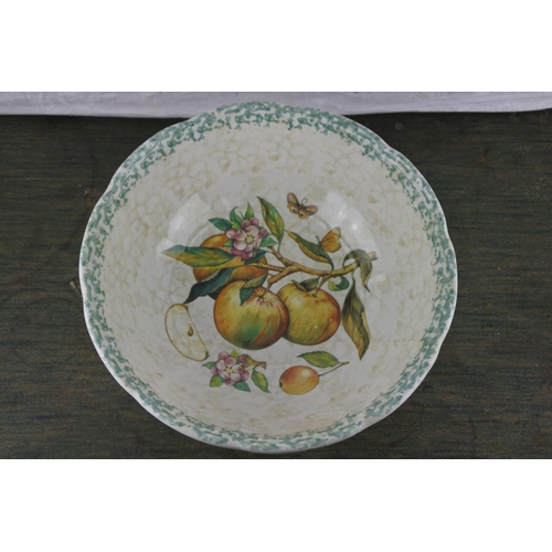 715 - A large bowl with fruit pattern.