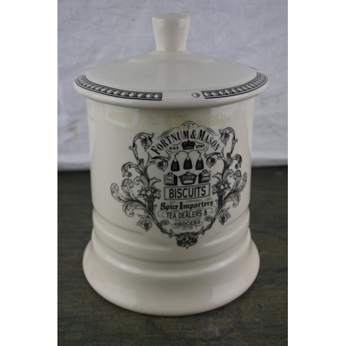 716 - A Fortnum & Mason lidded biscuit cannister.