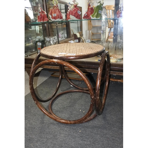 719 - A vintage rattan topped stool/table.