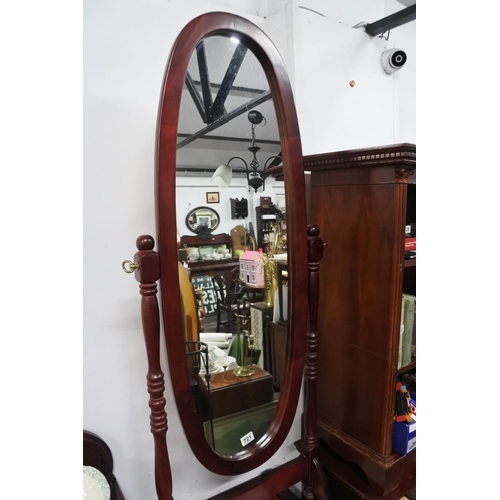 721 - A dressing mirror on stand, measuring 118cm x 53cm approximately.