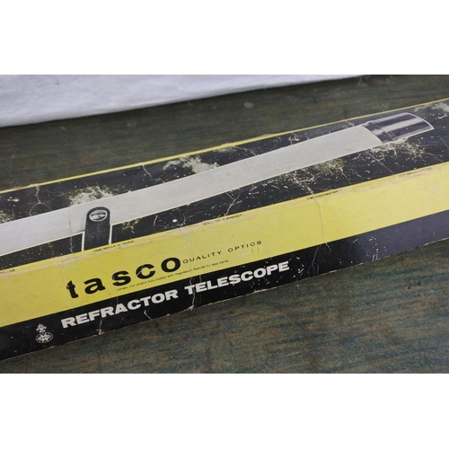 734 - A vintage boxed Tasco telescope.