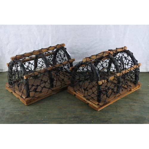 738 - Two miniature lobster pots.