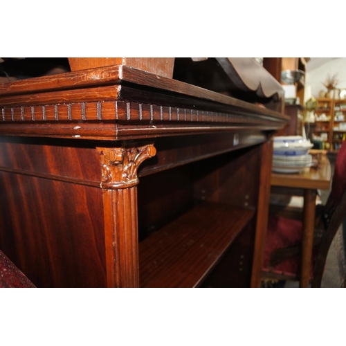 740 - A mahogany bookcase with pillar column detail to the sides, measuring 96cm x 102cm x 38cm approximat... 