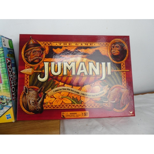 755 - A collection of board games to include Monopoly City, Scrabble, Jumanji and more.