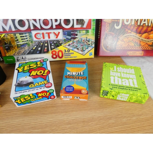 755 - A collection of board games to include Monopoly City, Scrabble, Jumanji and more.