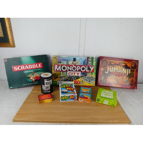 755 - A collection of board games to include Monopoly City, Scrabble, Jumanji and more.