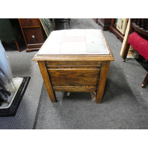 765 - An antique oak commode/stool.