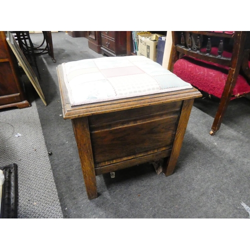 765 - An antique oak commode/stool.