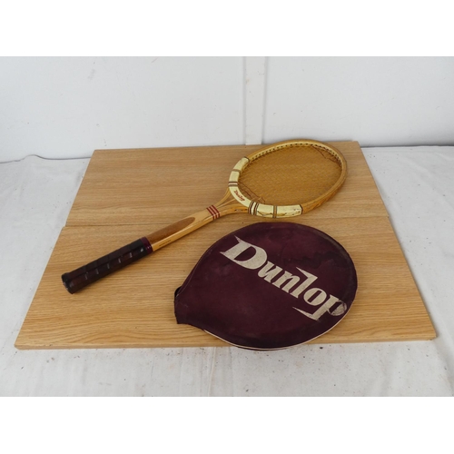 767 - A vintage Dunlop Maxply tennis racket and cover.