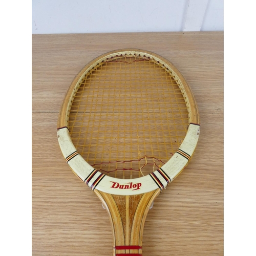 767 - A vintage Dunlop Maxply tennis racket and cover.