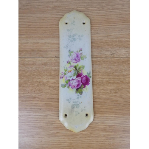 774 - A vintage ceramic floral fingerplate for a door.