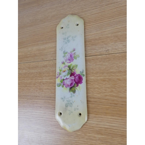 774 - A vintage ceramic floral fingerplate for a door.