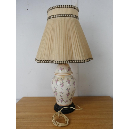 779 - A pair of cupid style table lamps and two others.