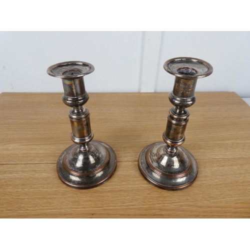 788 - A pair of plated candlesticks.