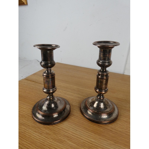 788 - A pair of plated candlesticks.