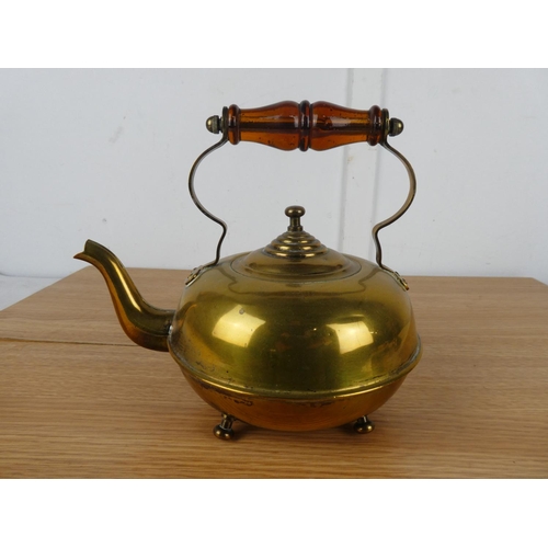 789 - A vintage brass teapot.