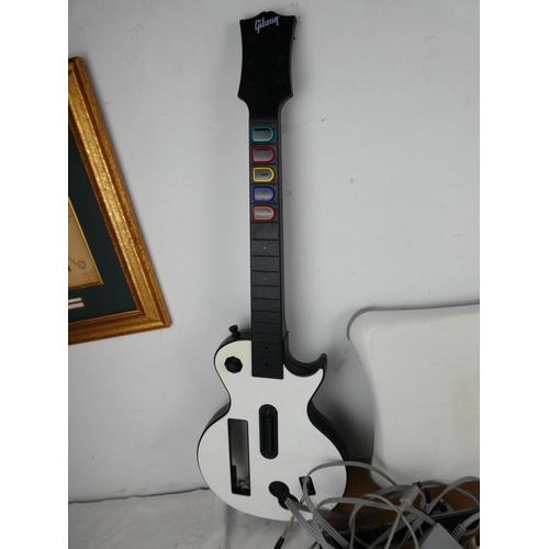 795 - A collection of Wii games, controllers, guitars and more.