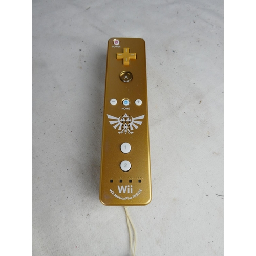 795 - A collection of Wii games, controllers, guitars and more.