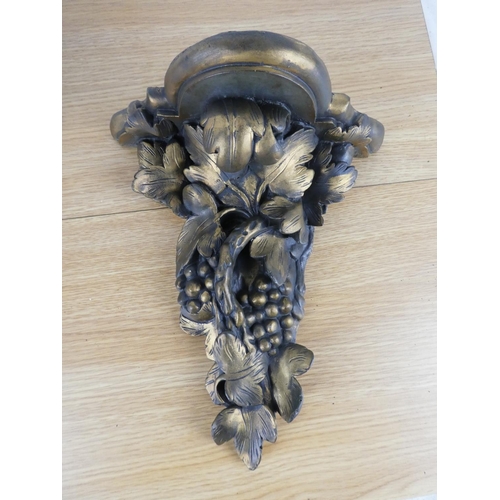 823 - A pair of decorative wall brackets.