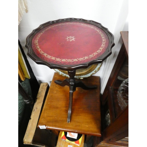 825 - A leather topped wine table.