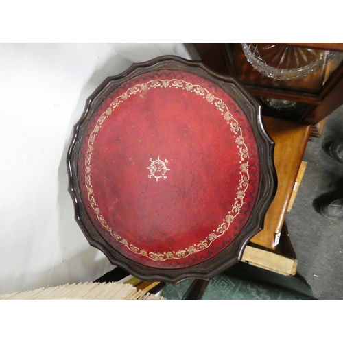 825 - A leather topped wine table.