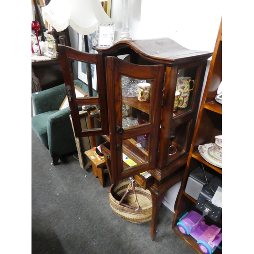 829 - A small wooden two door display cabinet with drawer, measuring 127cm x 59cm x 30cm approximately.