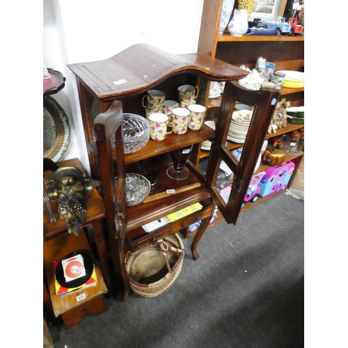 829 - A small wooden two door display cabinet with drawer, measuring 127cm x 59cm x 30cm approximately.